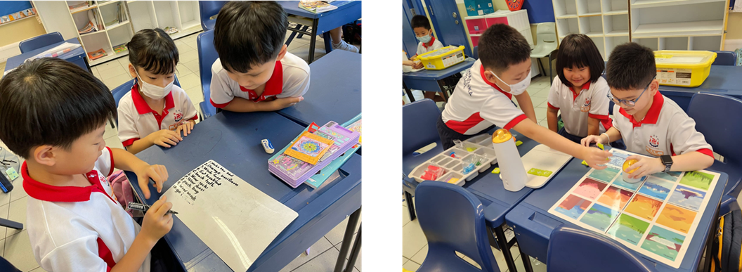 Young students in white and red uniforms work together at blue desks in a classroom, writing and examining colorful cards.